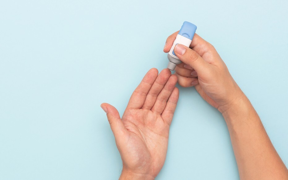 Lancet poking a finger