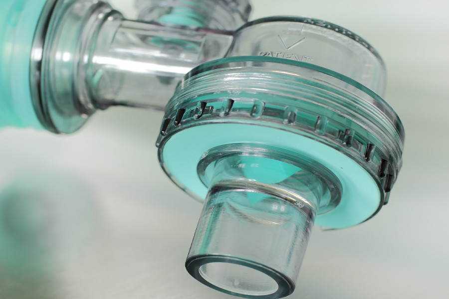 A lightweight, transparent valve with silicone flaps for unidirectional airflow. 