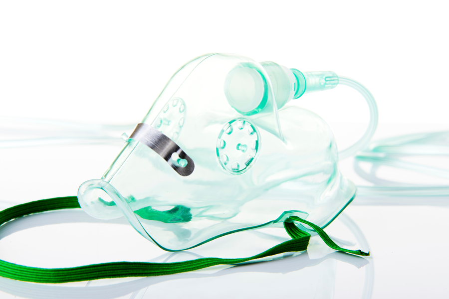 A transparent face mask with connected oxygen tubing, showcasing its ergonomic design. 